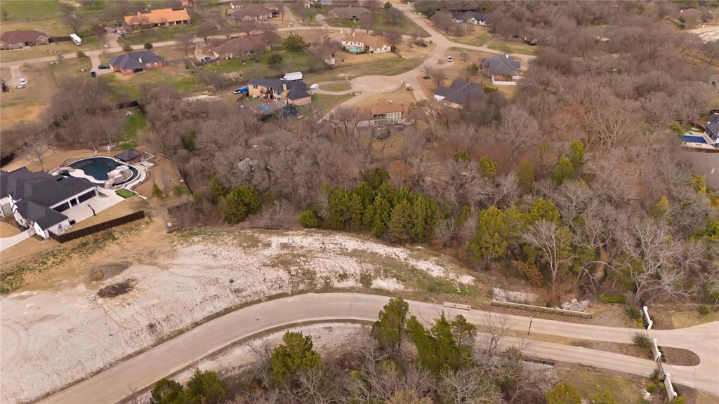 a view of a yard with car parked