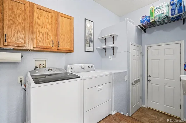 a view of storage and utility room with a sink