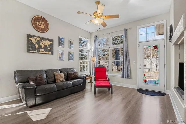 a living room with furniture and a table