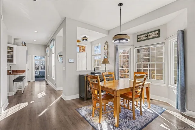 a dining room with furniture window wooden floor