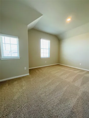 a bathroom with a toilet and a bathtub
