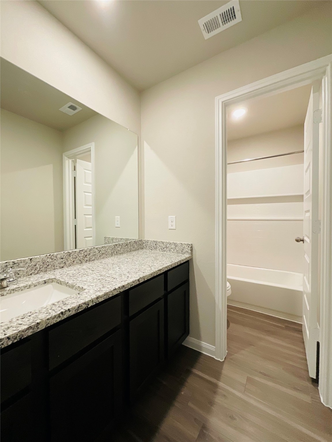 5311 Briana Dee Drive Rosharon, TX 77583 - Photo 18 of 21 a bathroom with a granite countertop sink and a mirror