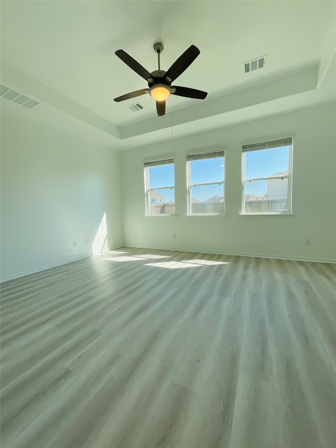 5311 Briana Dee Drive Rosharon, TX 77583 - Photo 9 of 21 a view of empty room with wooden floor and ceiling fan
