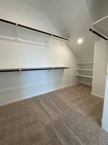 a bathroom with a sink a large mirror and vanity