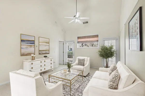 a living room with furniture and decor