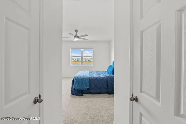 a bedroom with bed and a window