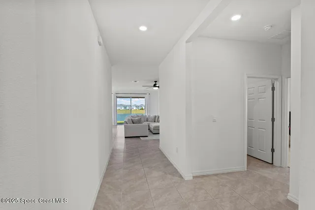 a view of a hallway with a room