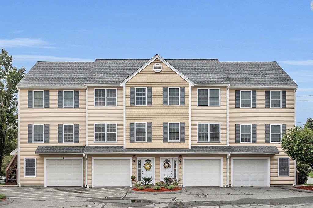 a front view of a house with yard