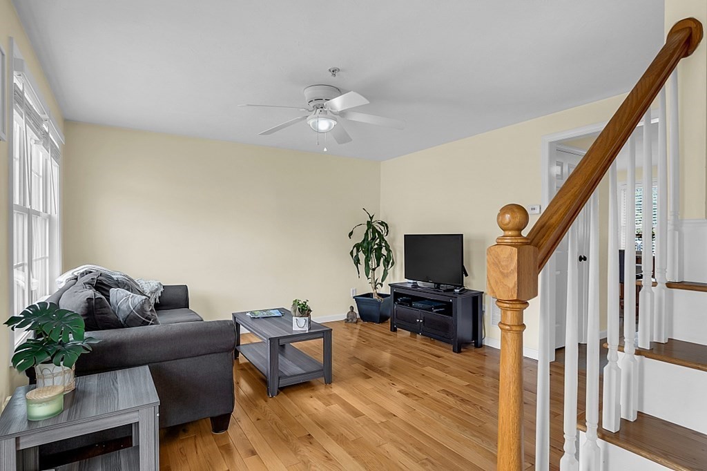 417 Hildreth Street, Unit 3 Lowell, MA 01850 - Photo 14 of 37 a living room with furniture and a flat screen tv