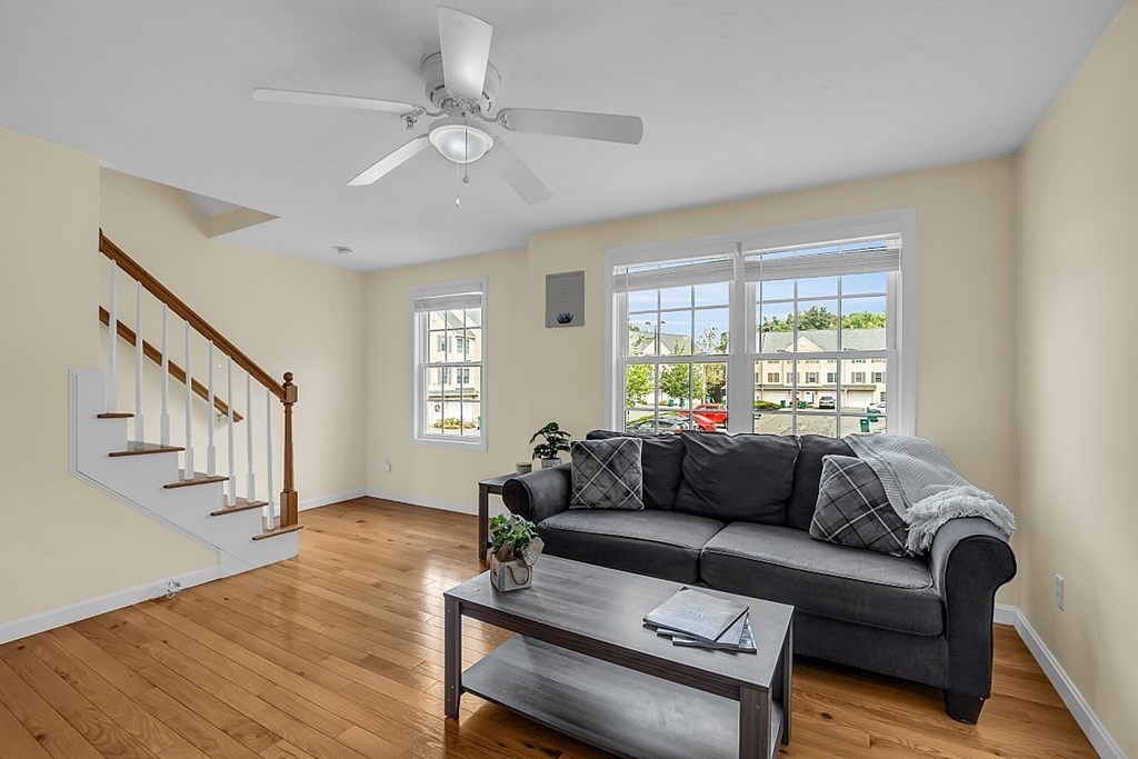 417 Hildreth Street, Unit 3 Lowell, MA 01850 - Photo 15 of 37 a living room with furniture and wooden floor