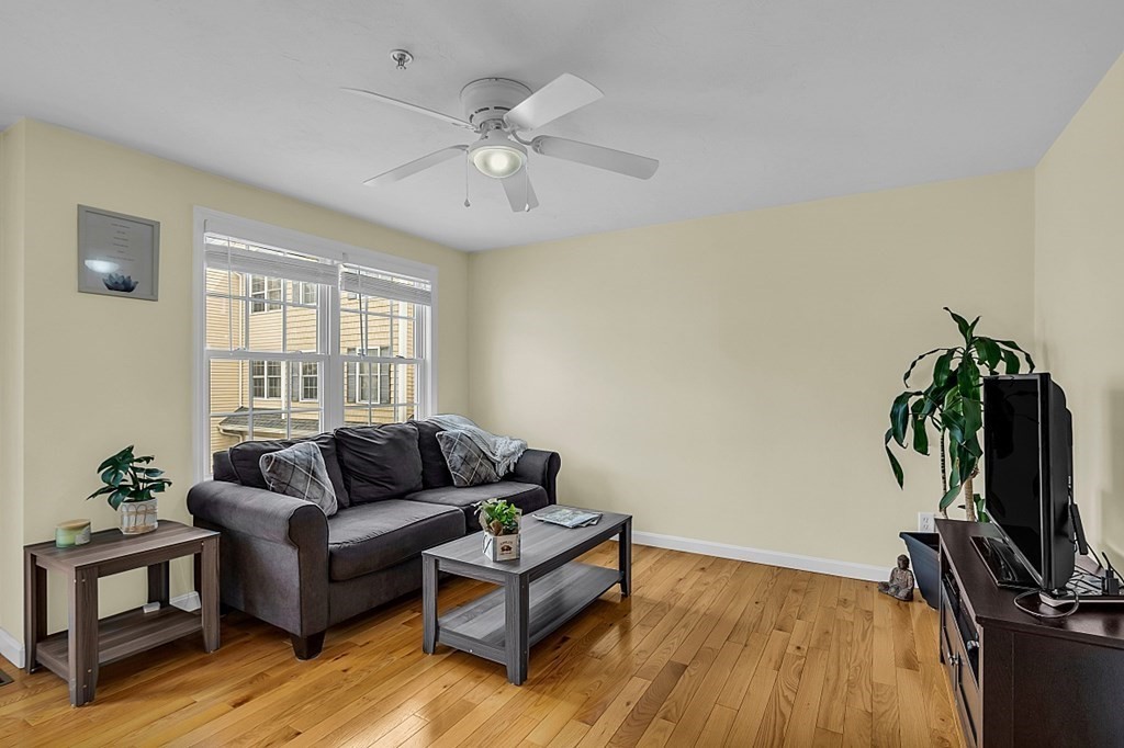 417 Hildreth Street, Unit 3 Lowell, MA 01850 - Photo 18 of 37 a living room with furniture and a flat screen tv