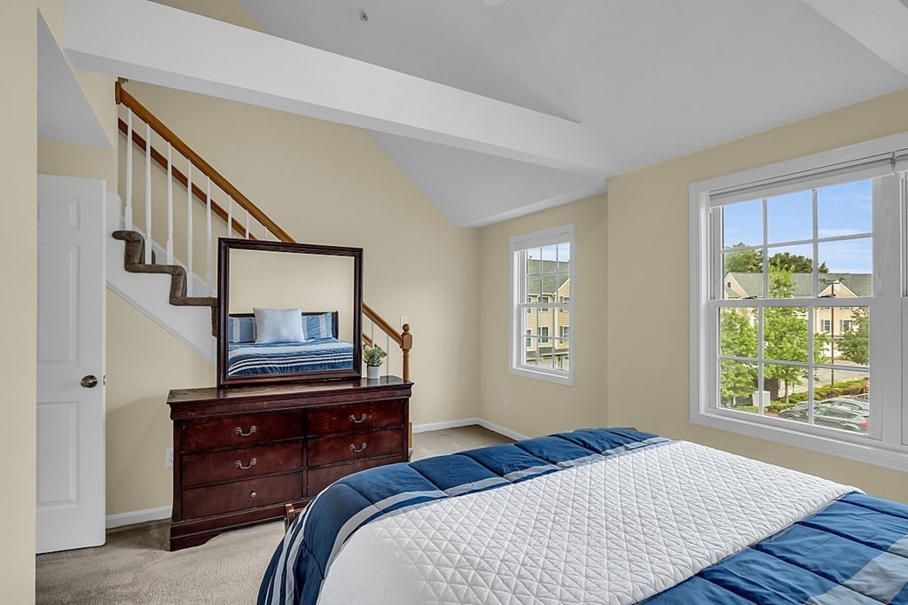 417 Hildreth Street, Unit 3 Lowell, MA 01850 - Photo 21 of 37 a bedroom with a bed and a window