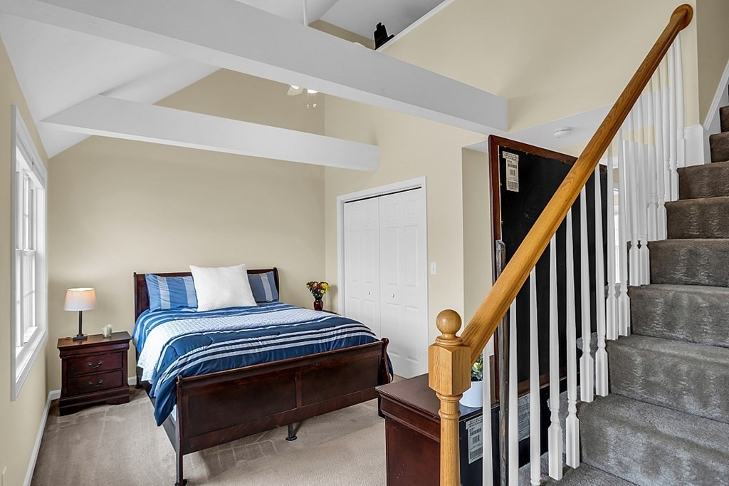 417 Hildreth Street, Unit 3 Lowell, MA 01850 - Photo 22 of 37 a bedroom with bed and wooden floor