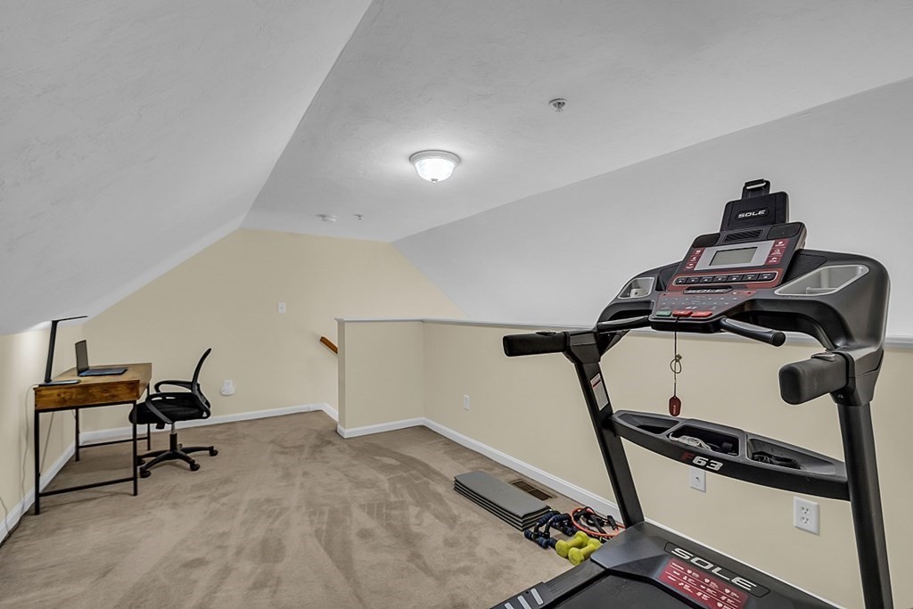 417 Hildreth Street, Unit 3 Lowell, MA 01850 - Photo 24 of 37 a view of a room with gym equipment