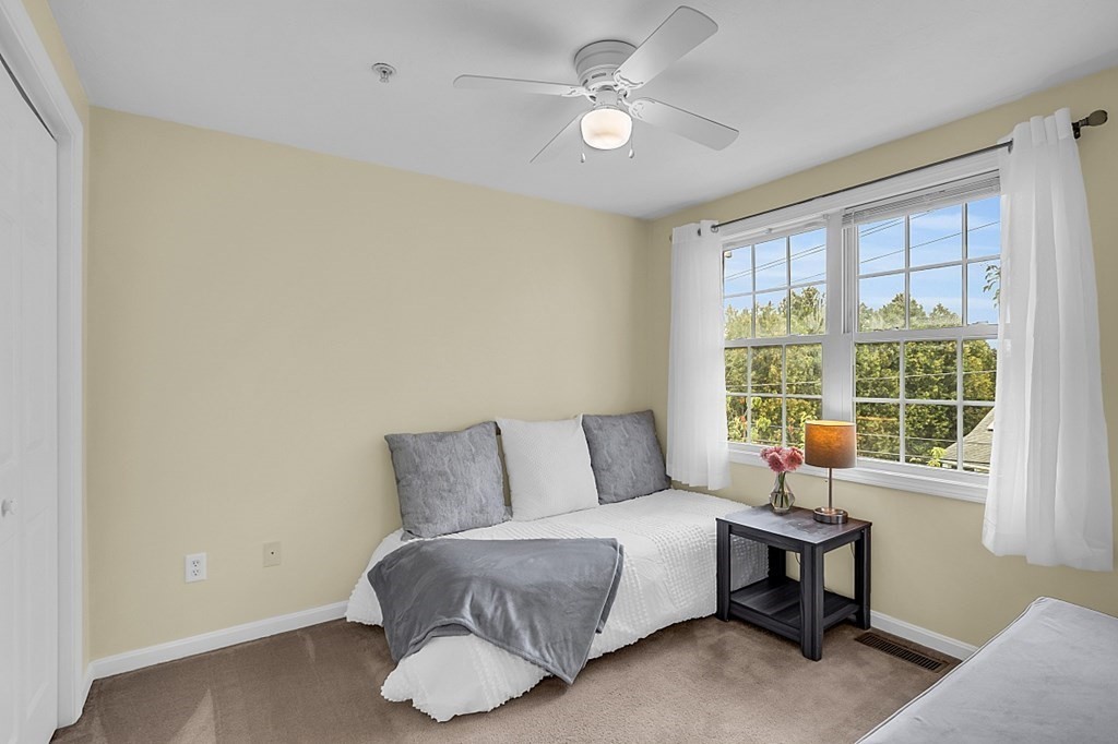 417 Hildreth Street, Unit 3 Lowell, MA 01850 - Photo 26 of 37 a living room with furniture and a window