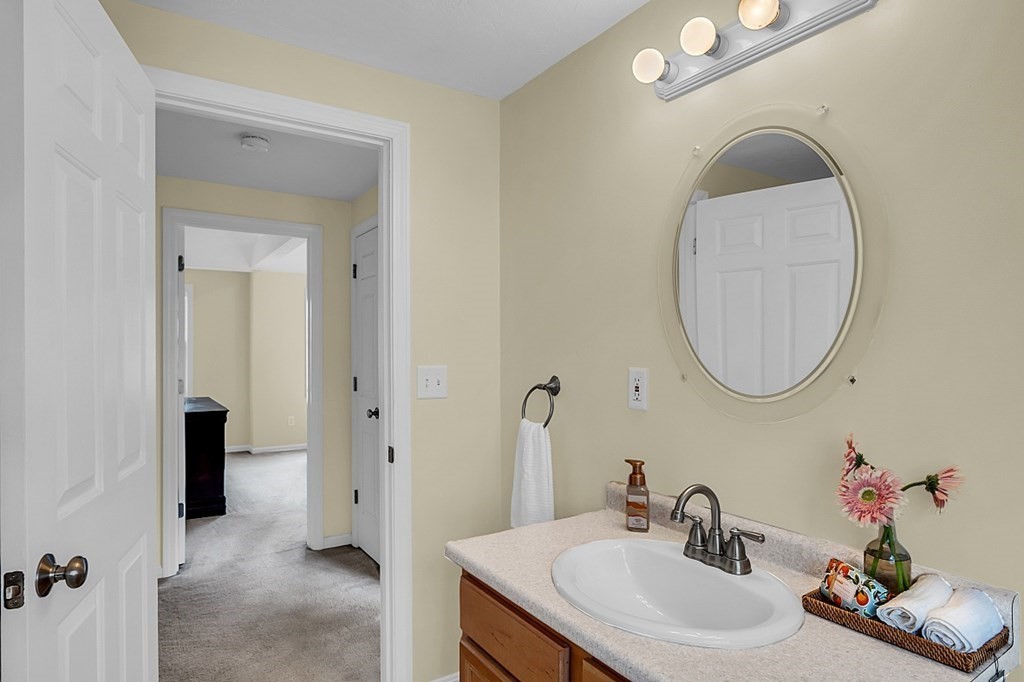 417 Hildreth Street, Unit 3 Lowell, MA 01850 - Photo 29 of 37 a bathroom with a sink and a mirror