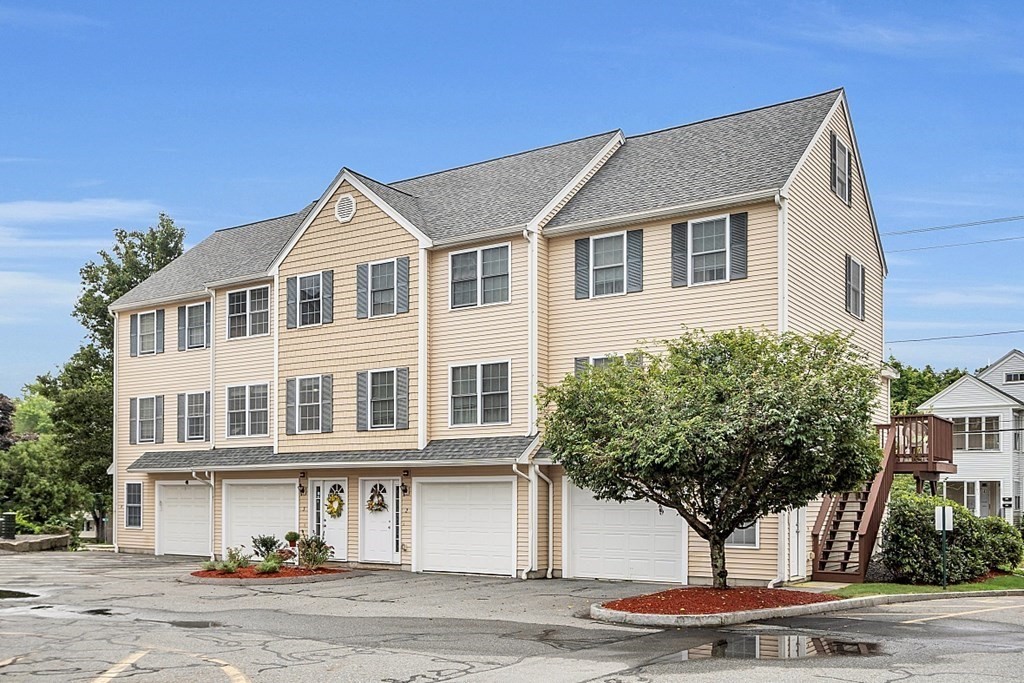 417 Hildreth Street, Unit 3 Lowell, MA 01850 - Photo 33 of 37 a front view of a house with a yard