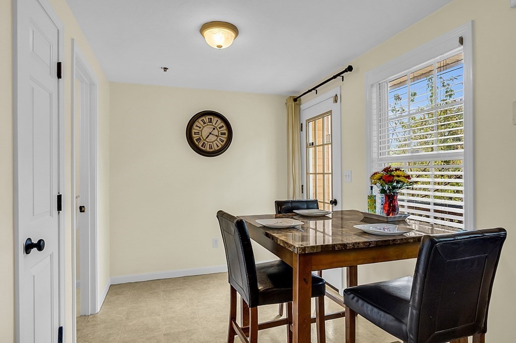 417 Hildreth Street, Unit 3 Lowell, MA 01850 - Photo 9 of 37 a view of a dining room with furniture and window