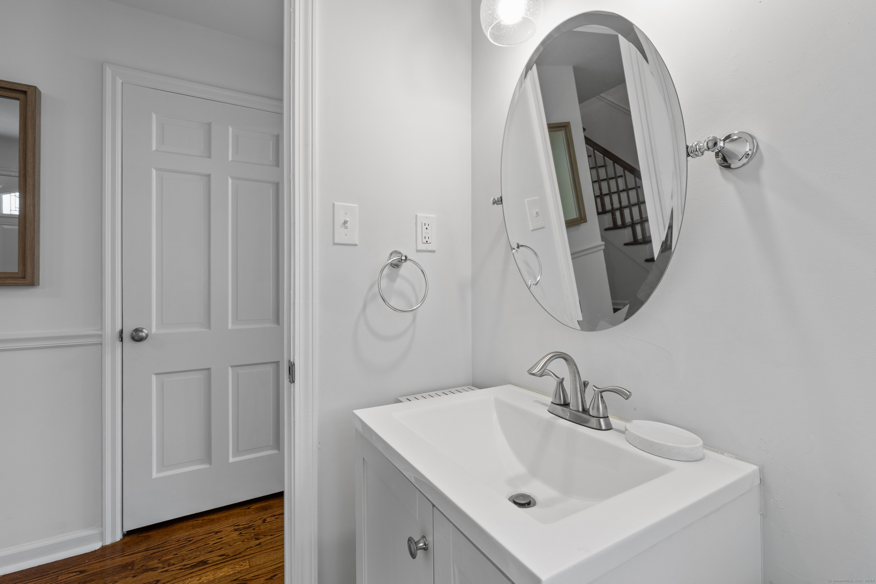 72 Cherry Lane Madison, CT 06443 - Photo 17 of 40 a bathroom with a sink and mirror