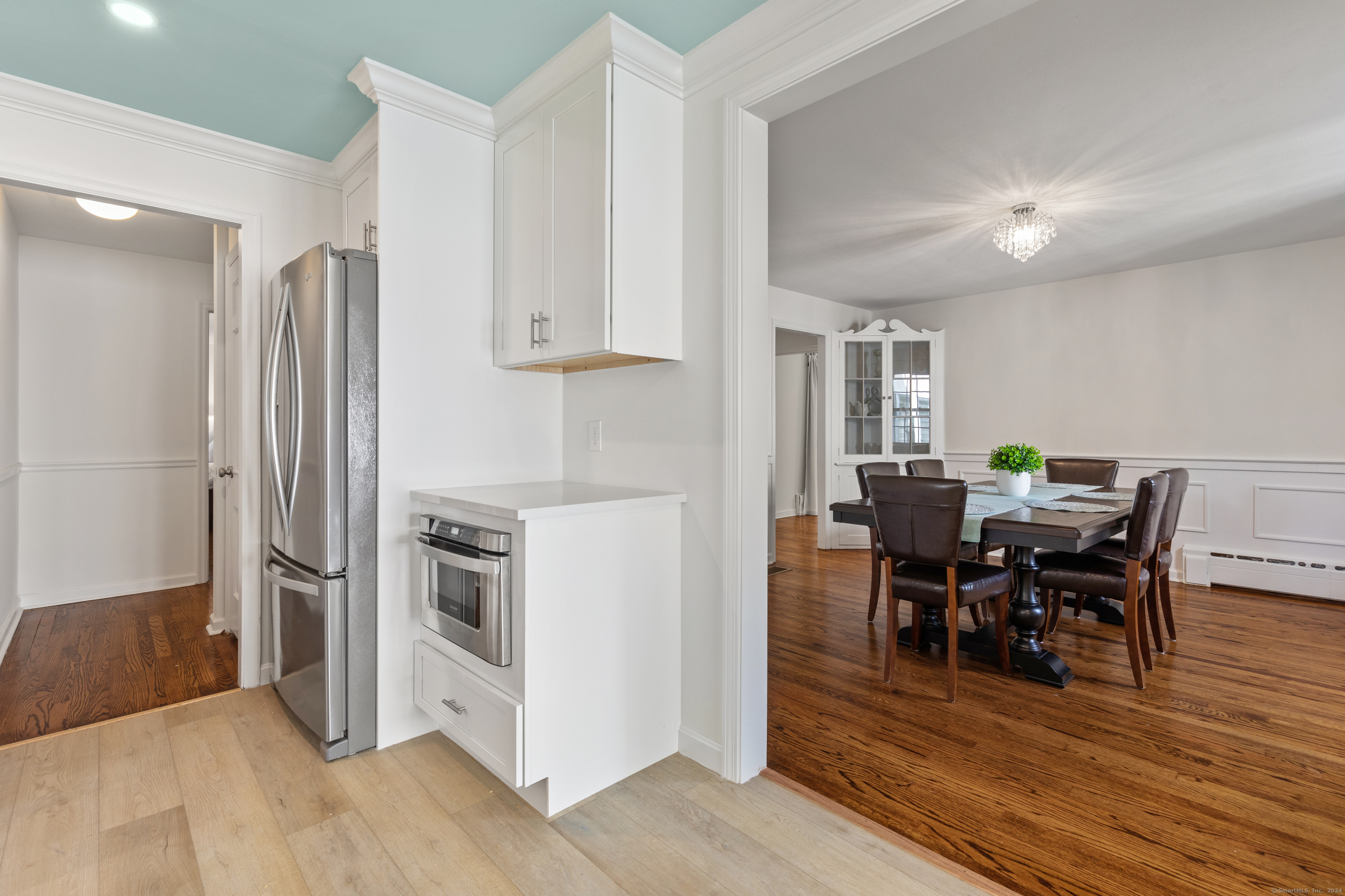 72 Cherry Lane Madison, CT 06443 - Photo 21 of 40 a view of a dining room with furniture and wooden floor