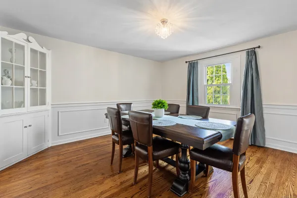 a view of a dining room with furniture window and wooden floor