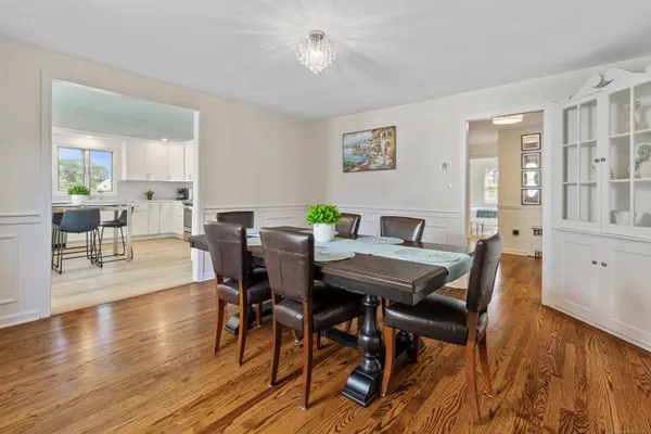 a view of a dining room with furniture window and wooden floor
