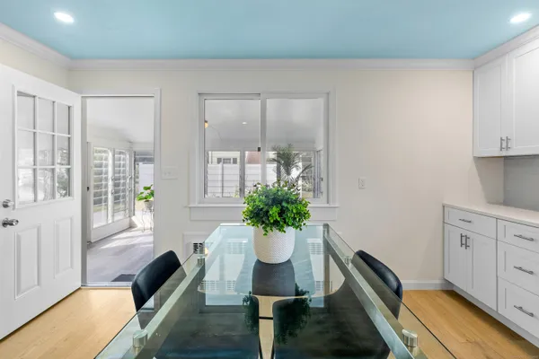 a view of a living room and a potted plant