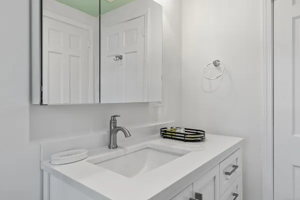 a kitchen with a sink and cabinets