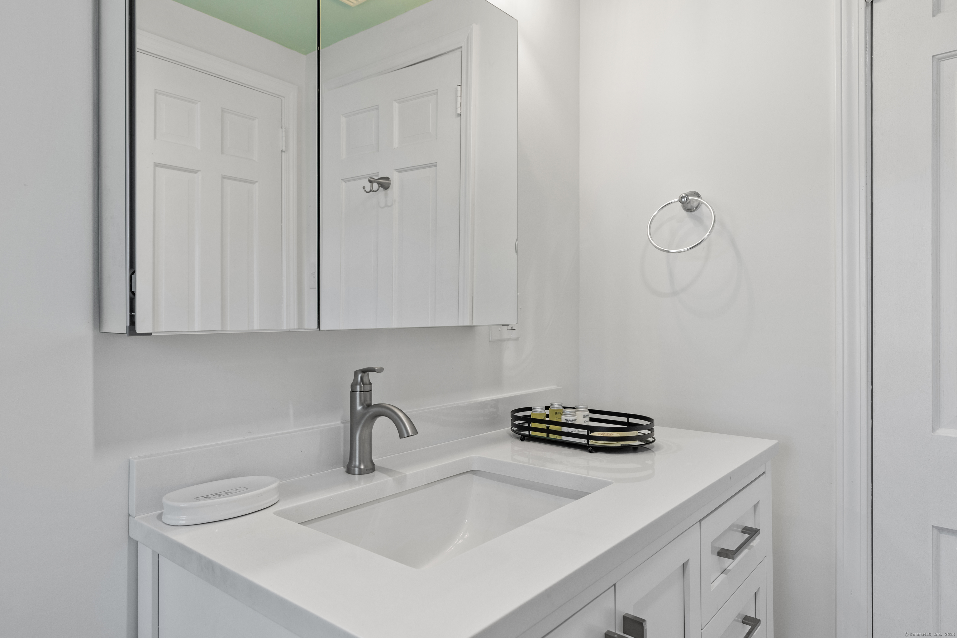 72 Cherry Lane Madison, CT 06443 - Photo 31 of 40 a kitchen with a sink and cabinets