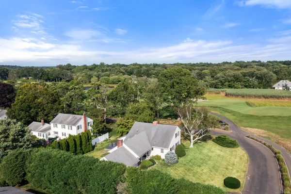 an aerial view of a house with a garden
