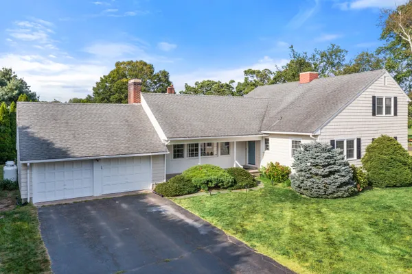 front view of a house with a yard