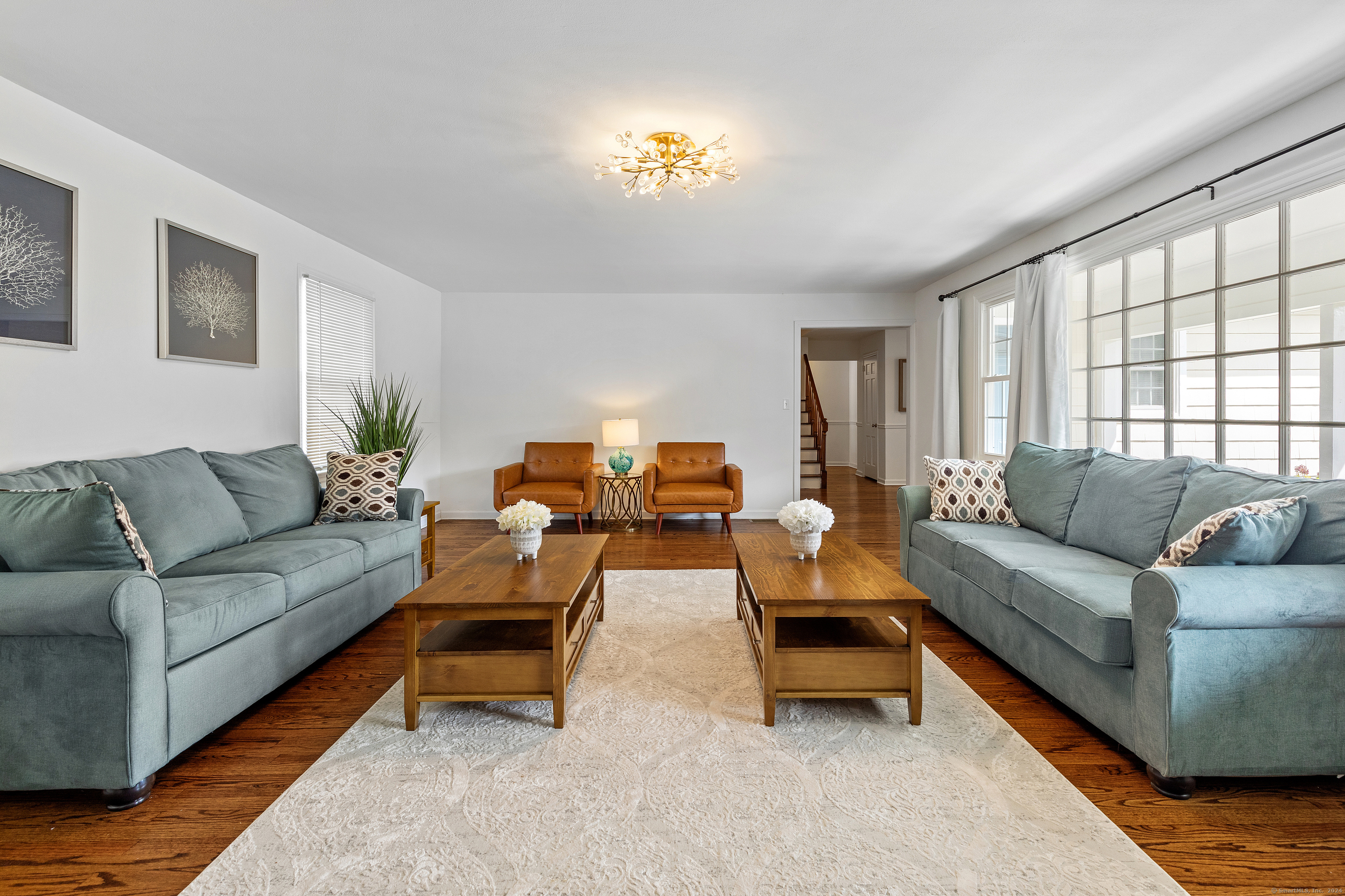 72 Cherry Lane Madison, CT 06443 - Photo 8 of 40 a living room with furniture and a large window