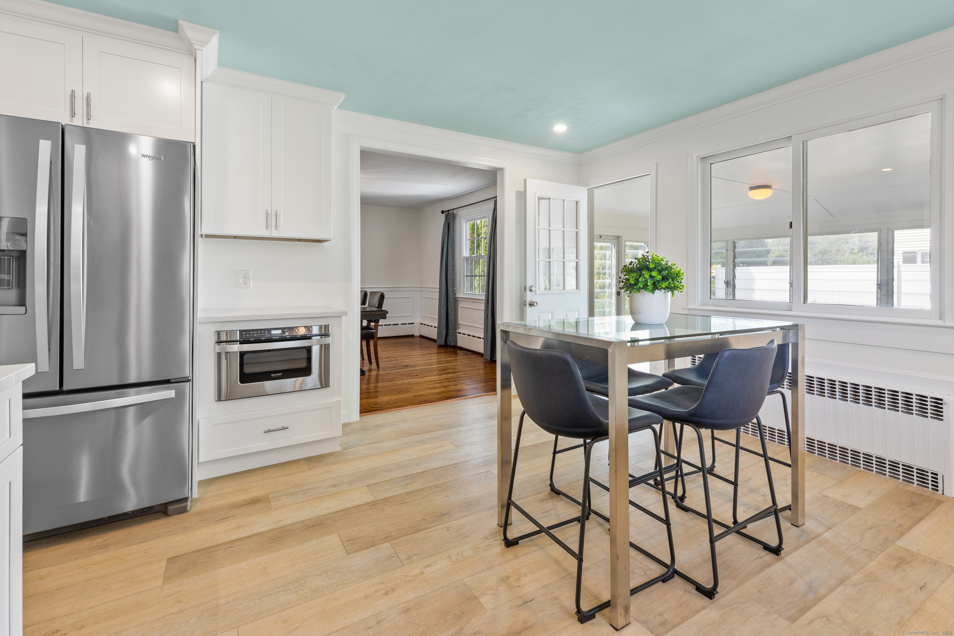72 Cherry Lane Madison, CT 06443 - Photo 10 of 40 a dining room with furniture and a kitchen view