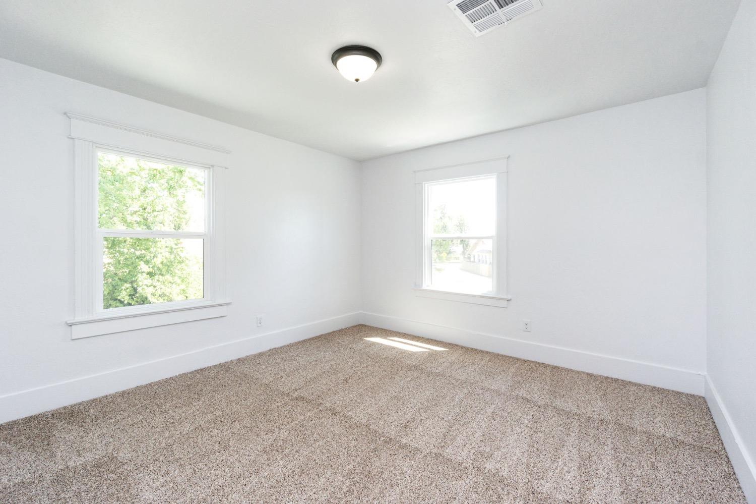 133 South Reed Avenue Reedley, CA 93654 - Photo 29 of 42 an empty room with windows