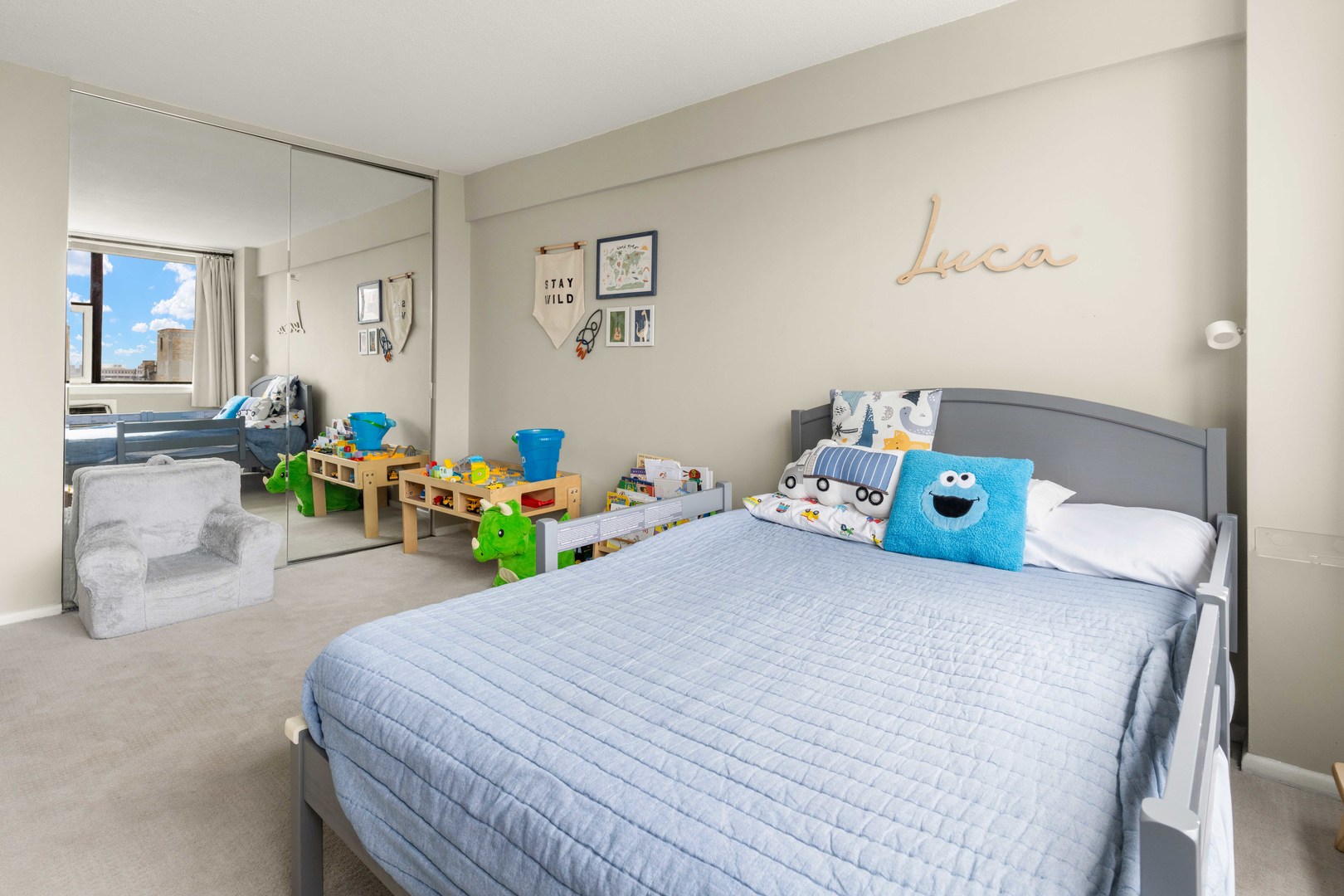 3110 North Sheridan Road, Unit 1205 Chicago, IL 60657 - Photo 11 of 21 a bedroom with a bed and wooden floor