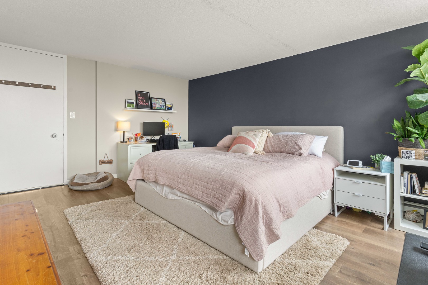 3110 North Sheridan Road, Unit 1205 Chicago, IL 60657 - Photo 13 of 21 a bedroom with a bed and a cabinets
