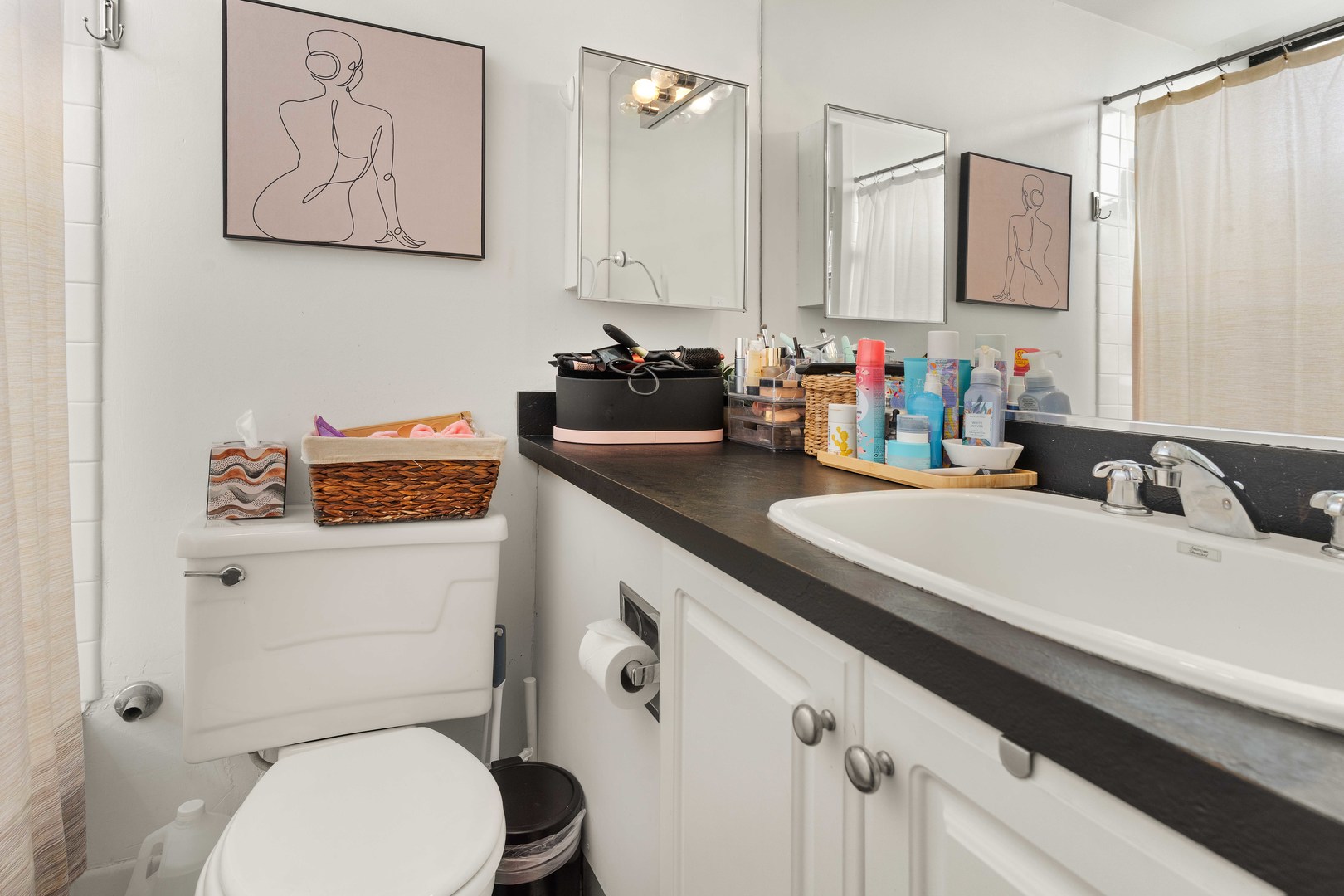 3110 North Sheridan Road, Unit 1205 Chicago, IL 60657 - Photo 14 of 21 a bathroom with a granite countertop sink mirror and toilet
