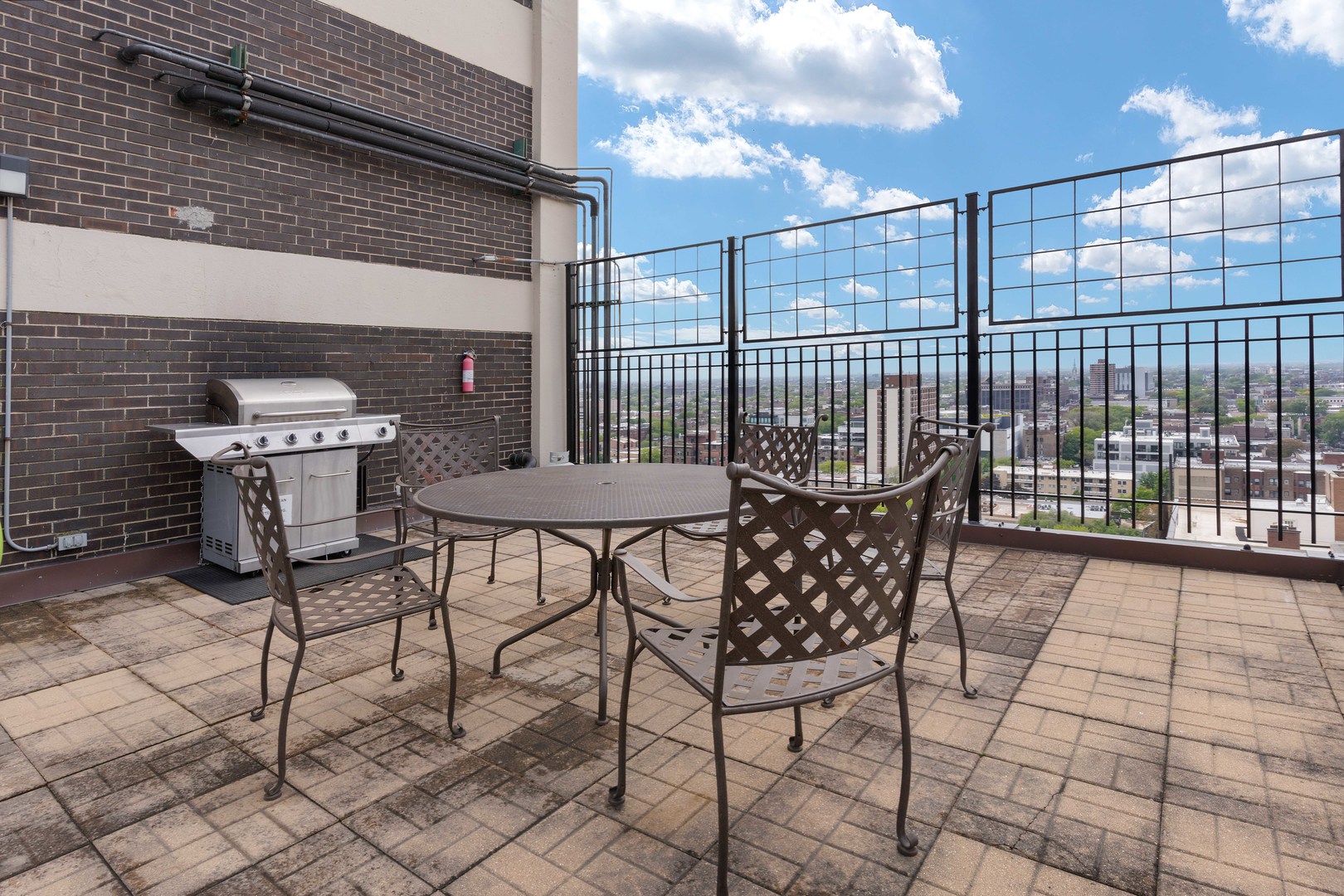 3110 North Sheridan Road, Unit 1205 Chicago, IL 60657 - Photo 16 of 21 a view of a chairs and table in the back yard of the house