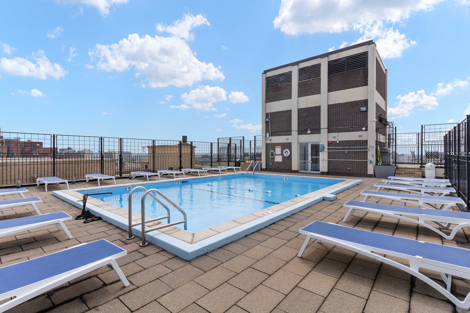 3110 North Sheridan Road, Unit 1205 Chicago, IL 60657 - Photo 20 of 21 a view of swimming pool with outdoor seating and city view