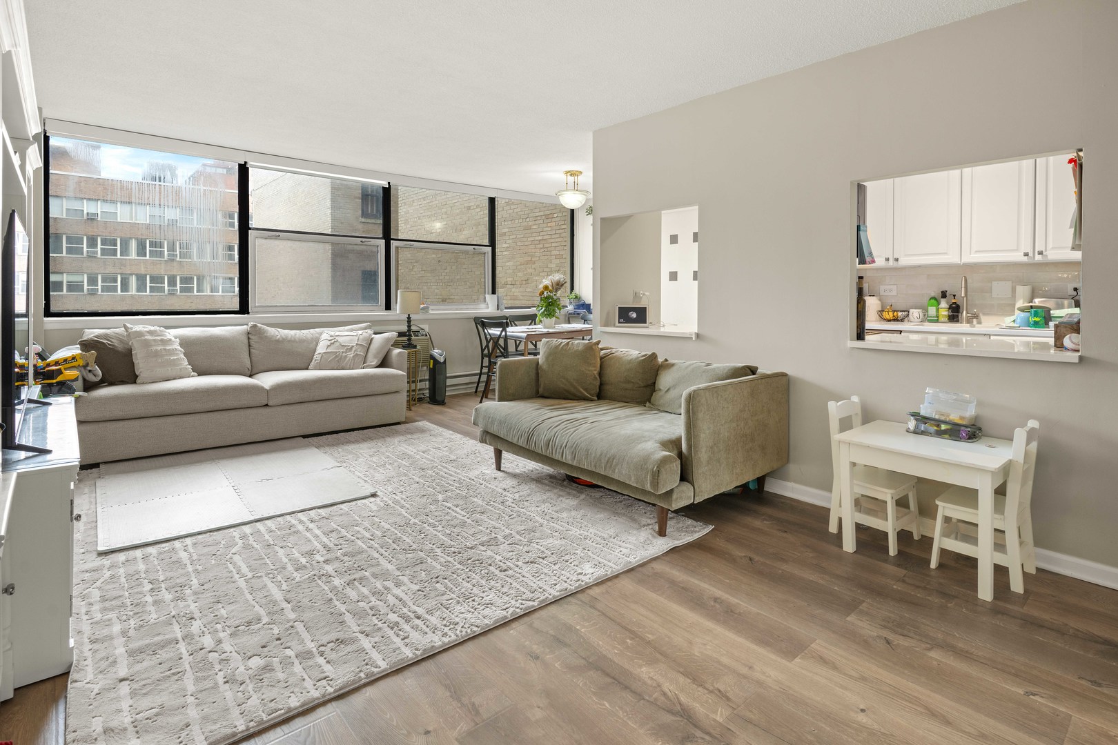 3110 North Sheridan Road, Unit 1205 Chicago, IL 60657 - Photo 2 of 21 a living room with furniture and a large window