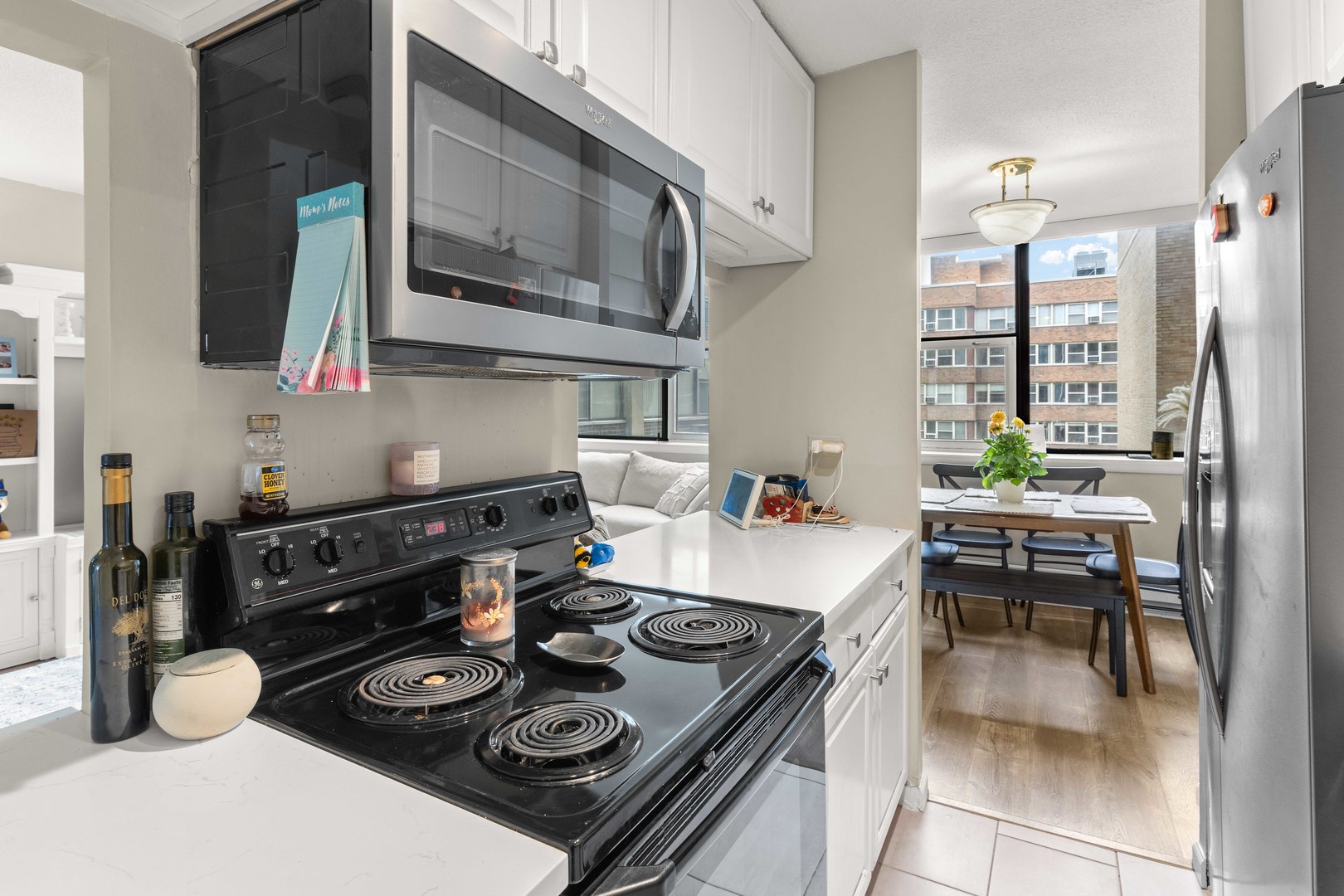 3110 North Sheridan Road, Unit 1205 Chicago, IL 60657 - Photo 6 of 21 a kitchen with a table and chairs