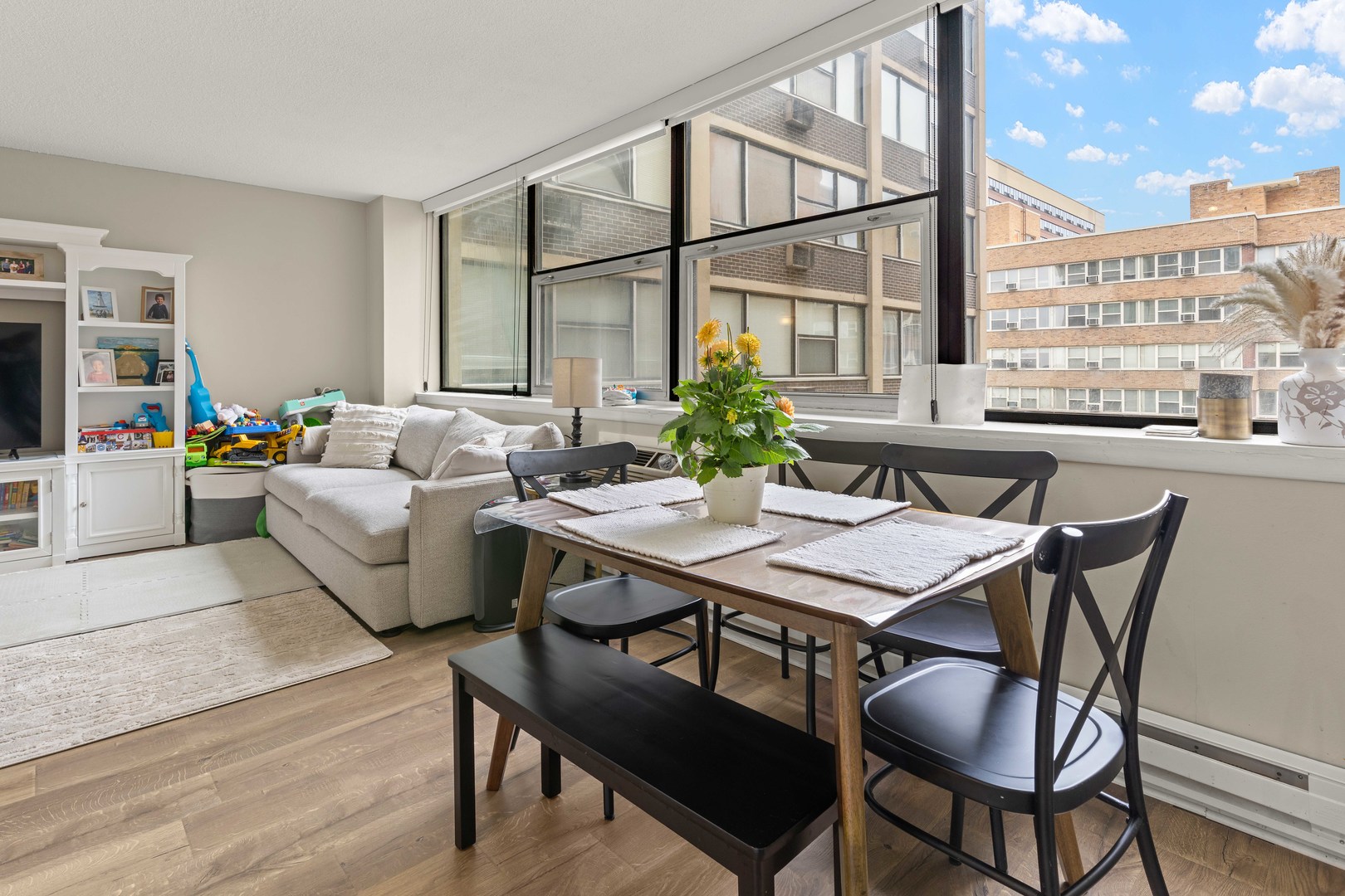 3110 North Sheridan Road, Unit 1205 Chicago, IL 60657 - Photo 7 of 21 a living room with furniture kitchen view and a large window