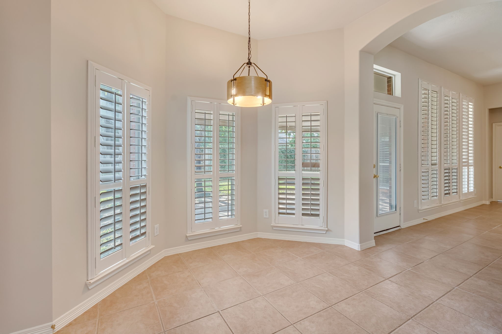 24919 Corbin Gate Drive Spring, TX 77389 - Photo 13 of 29 a view of an empty room with windows and fan