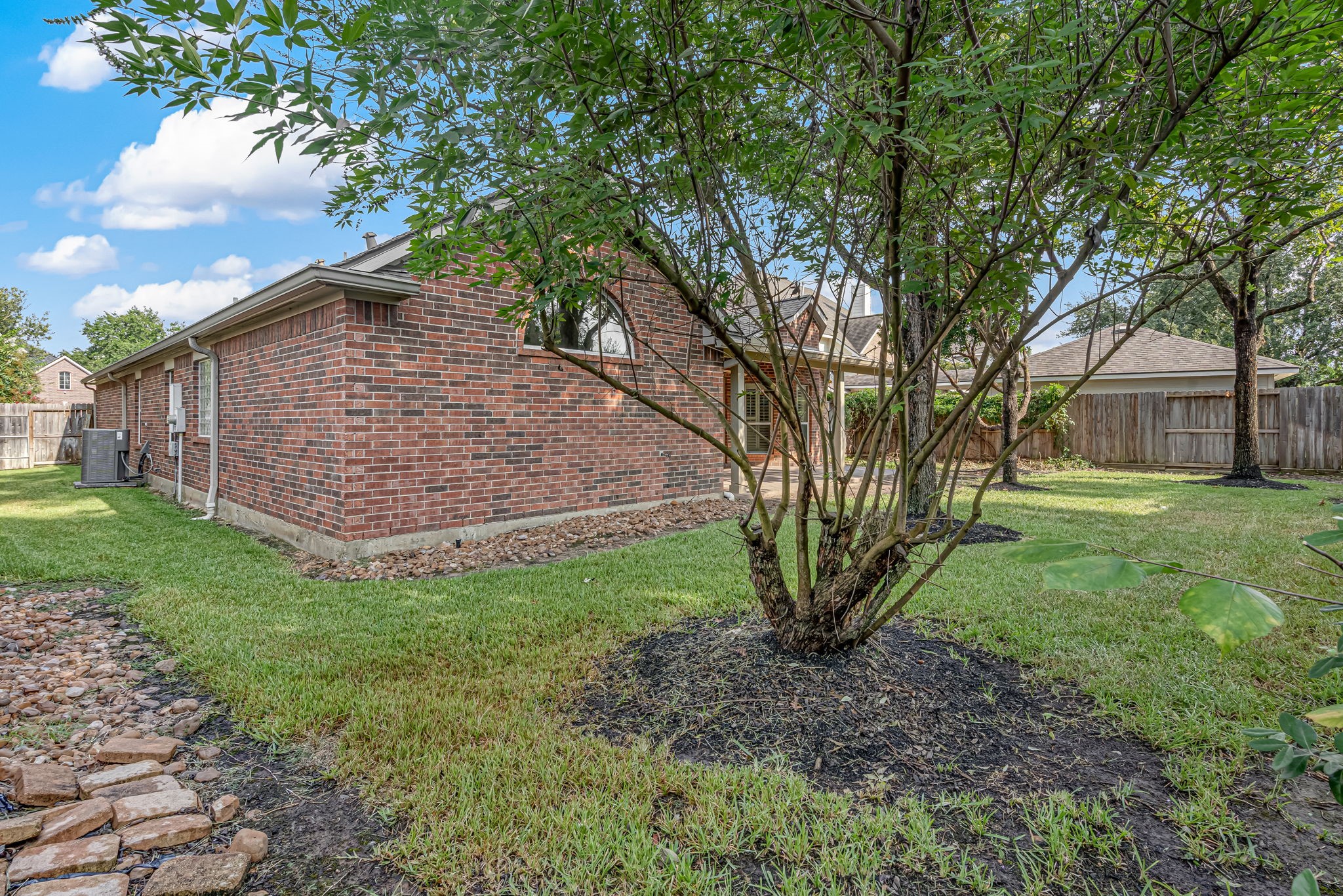 24919 Corbin Gate Drive Spring, TX 77389 - Photo 28 of 29 a view of a house with a yard