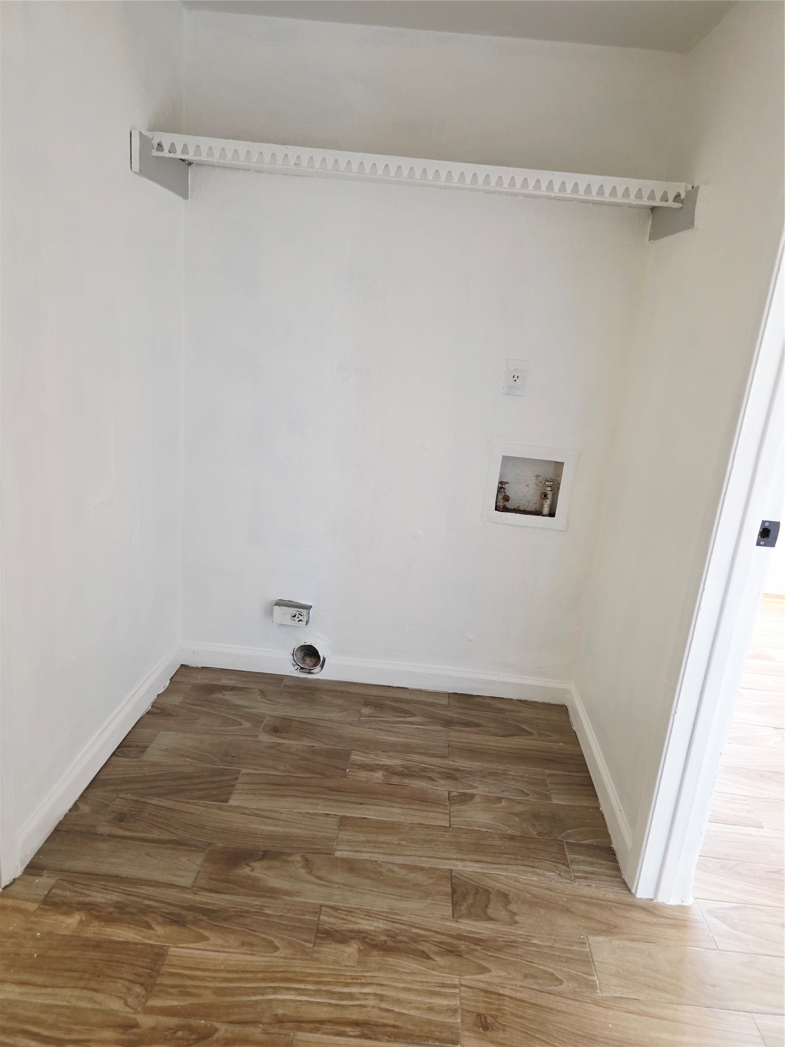 6200 West Tidwell Road, Unit 1702 Houston, TX 77092 - Photo 19 of 24 a view of a room with wooden floor and white walls