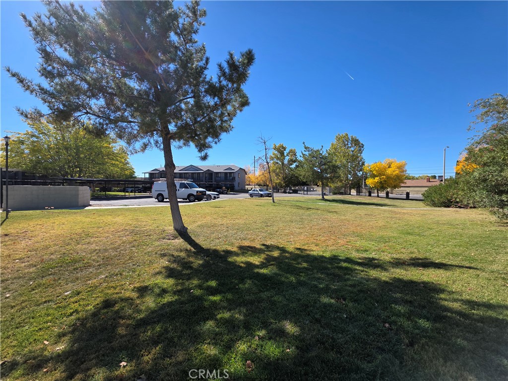 44036 25th Street West, Unit B7 Lancaster, CA 93536 - Photo 18 of 20 a view of a playground with basketball court