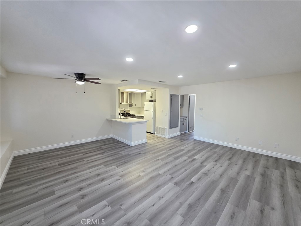 44036 25th Street West, Unit B7 Lancaster, CA 93536 - Photo 2 of 20 a view of empty room with wooden floor