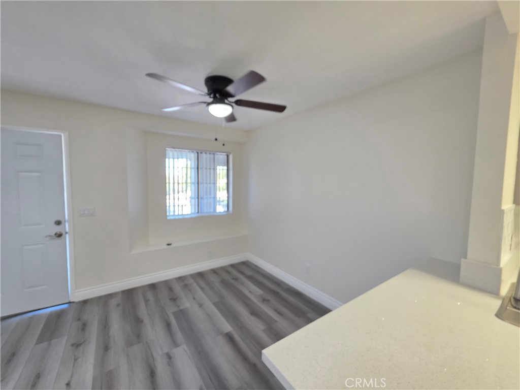 44036 25th Street West, Unit B7 Lancaster, CA 93536 - Photo 6 of 20 a view of empty room with wooden floor and fan