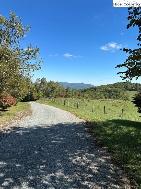 Fishers Peak View Ennice, NC 28623 - Photo 4 of 8 a view of a yard with a house