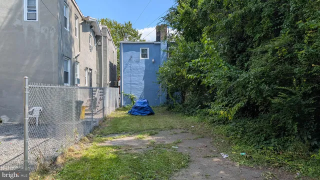 a view of a back yard of the house